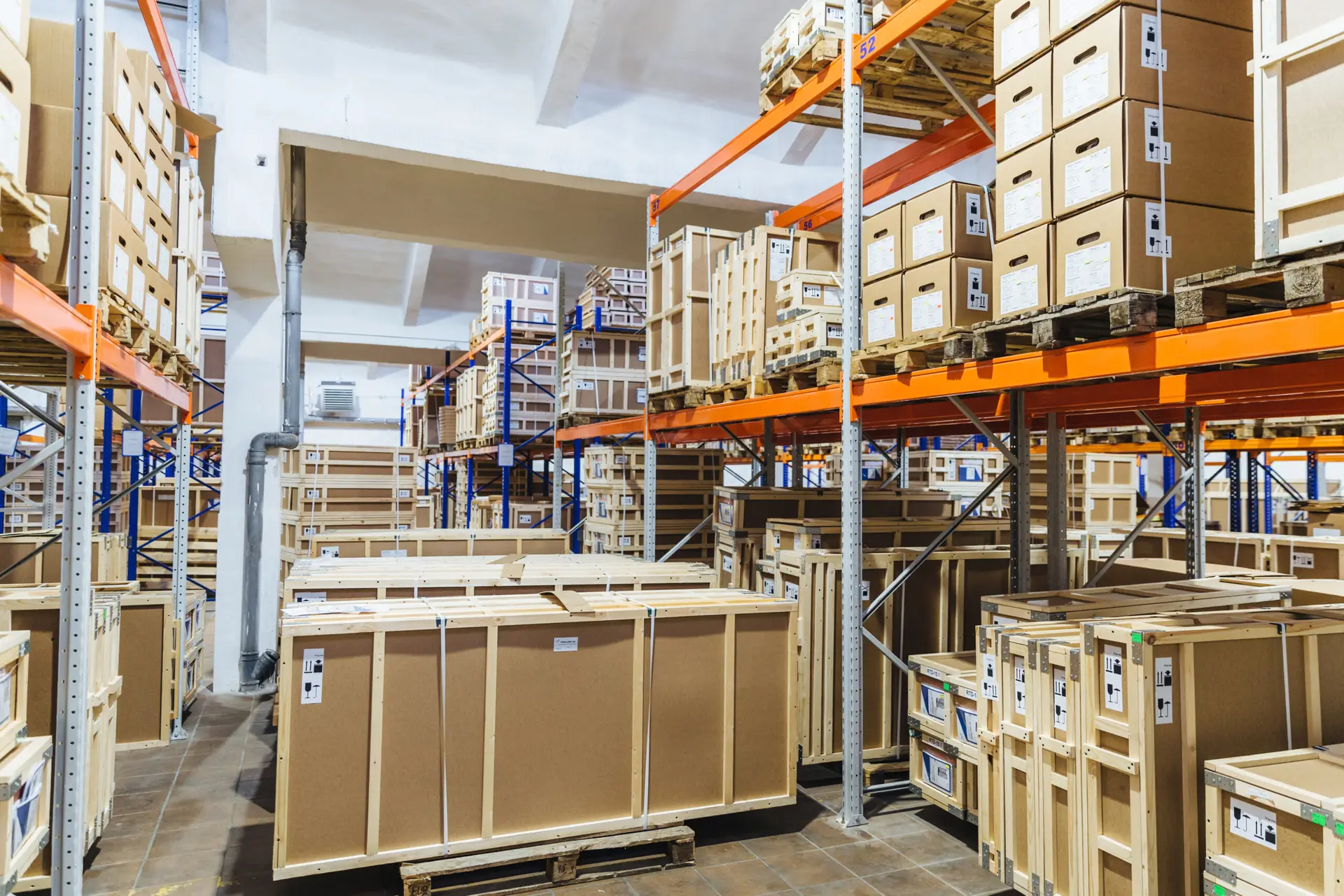 Logistic, industry, shipment, storage and manufacturing concept. Cargo boxes on shelves in warehouse. Industrial goods. Large long racks.